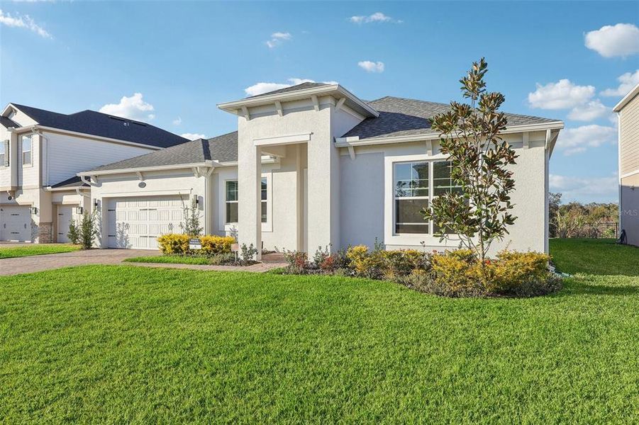Front exterior of a new home in , Apopka, FL, highlighting curb appeal (Image 23).