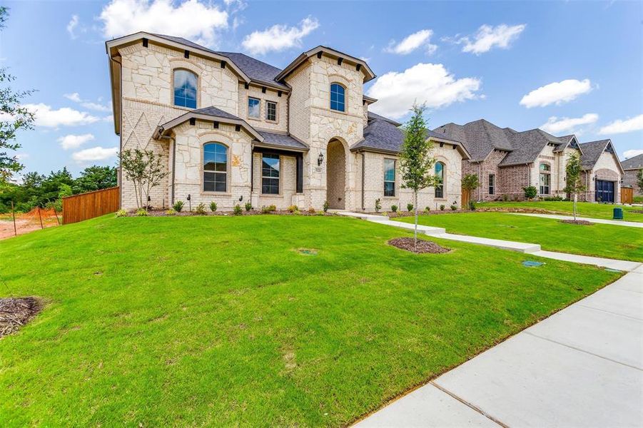 View of front of property with a front lawn