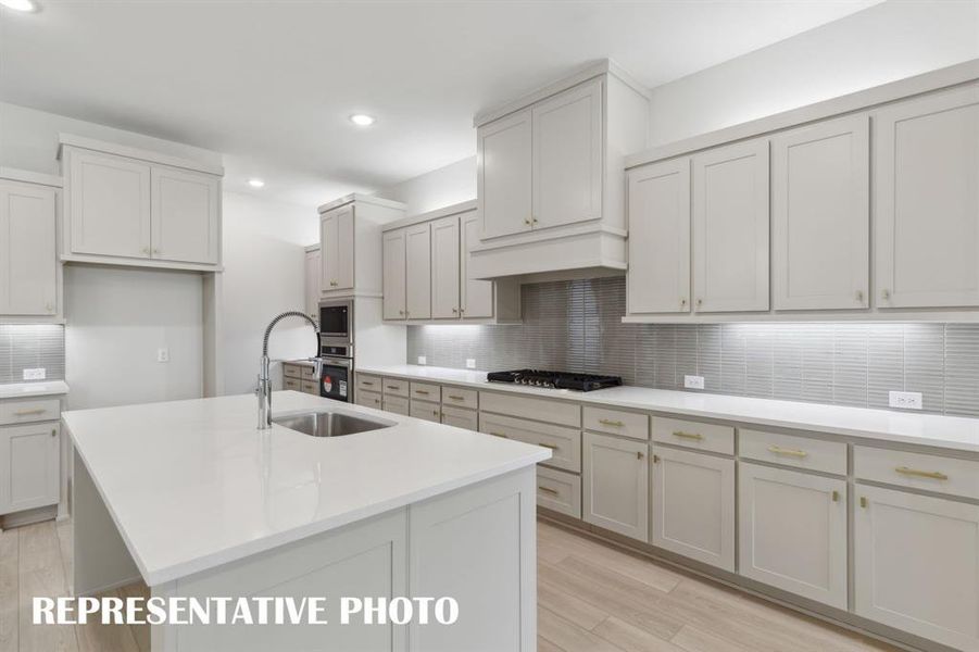 With fantastic storage and prep space, this dream kitchen would make any chef proud to call it their own!  REPRESENTATIVE PHOTO