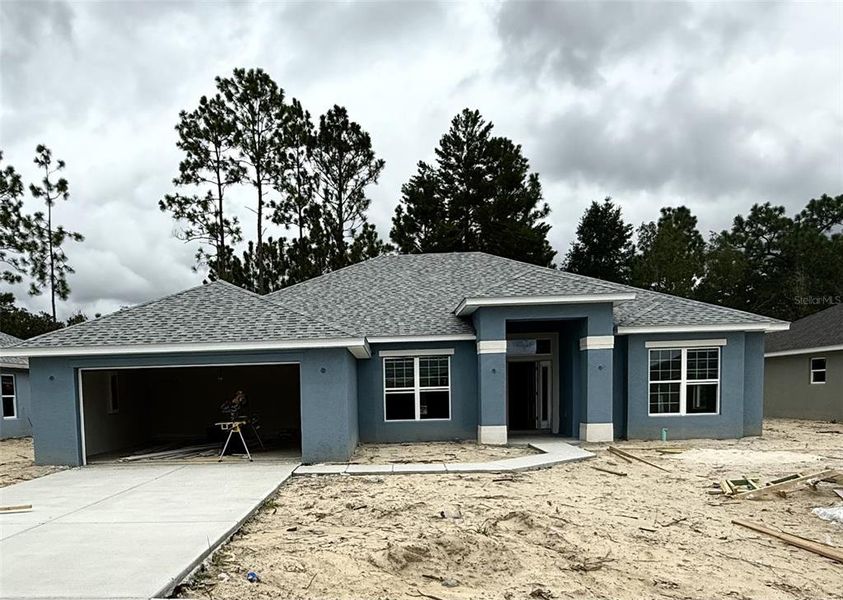 Front exterior of a new home in Citrus Springs Sub, Citrus Springs, FL, highlighting curb appeal (Image 2). Front exterior of a new home in Citrus Springs Sub, Citrus Springs, FL, highlighting curb appeal (Image 2).