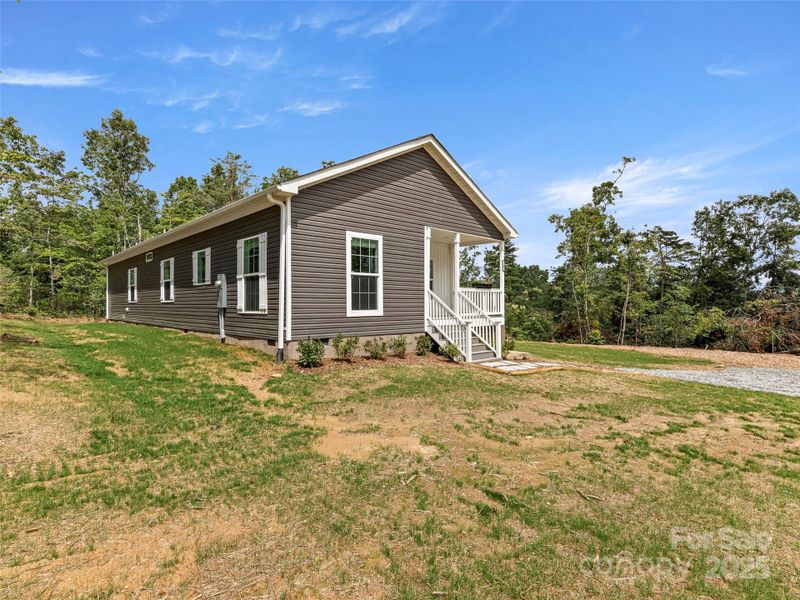 Front exterior of a new home in , Hendersonville, NC, highlighting curb appeal (Image 16).