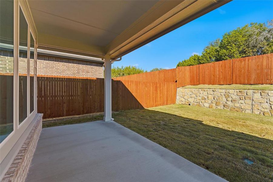 Exterior details and patio area of a home in Waterford Park, Weatherford (Image 28).