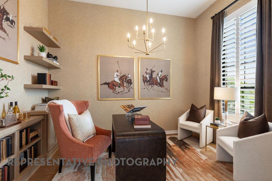 Sitting room featuring a chandelier and wood finished floors Sitting room featuring a chandelier and wood finished floors