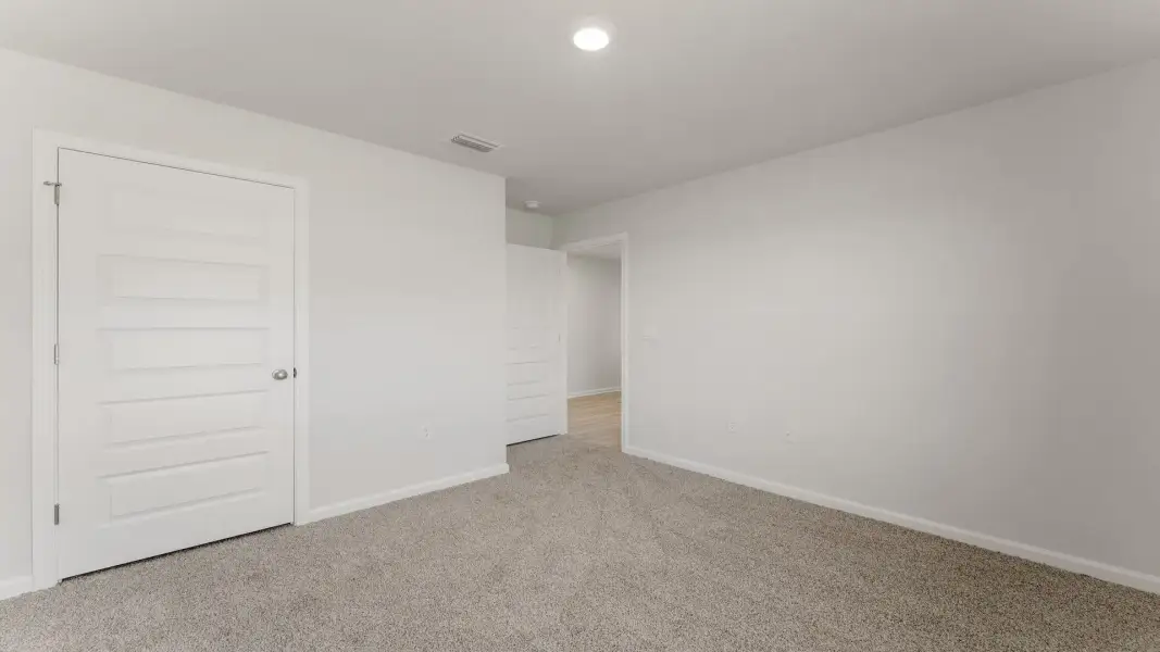 Spacious, unfurnished interior of a new home in Magnolia at the Bluffs Phase 3, Freeport (Image 26). Spacious, unfurnished interior of a new home in Magnolia at the Bluffs Phase 3, Freeport (Image 26).