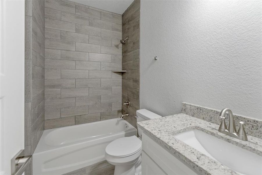 Hall bathroom serving the secondary bedrooms. Hall bathroom serving the secondary bedrooms.