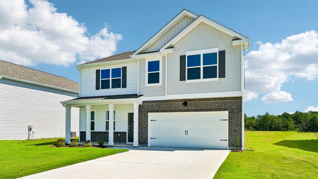Front exterior of a new home in Shahbain Reserve, Raeford, NC, highlighting curb appeal (Image 16).