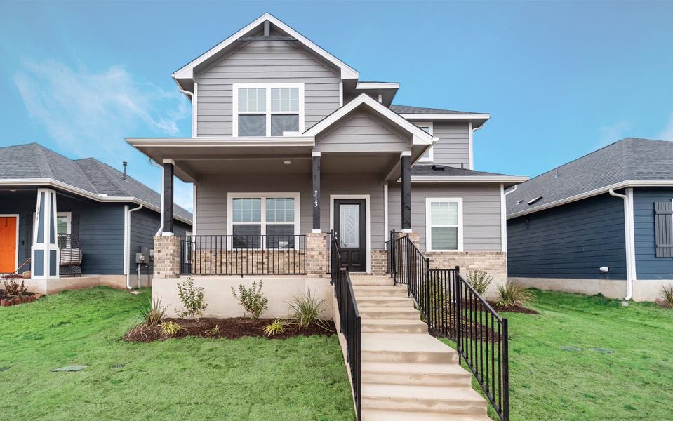 Front exterior of a new home in Brooklands, Hutto, TX, highlighting curb appeal (Image 1).