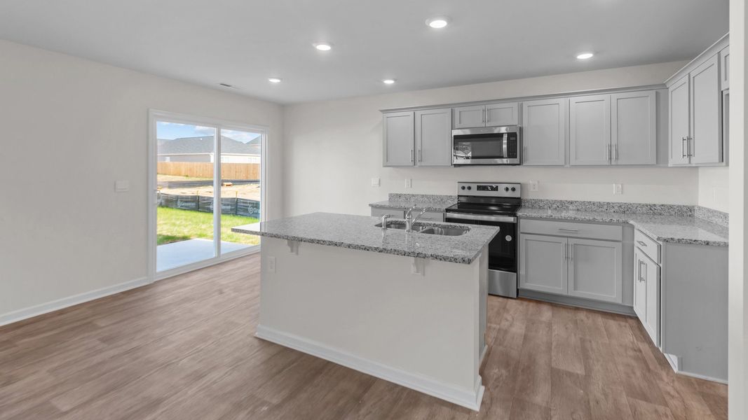 Representative furnished interior of a home built from the OLIVER by D.R. Horton in River's Edge, Mayodan (Image 6).