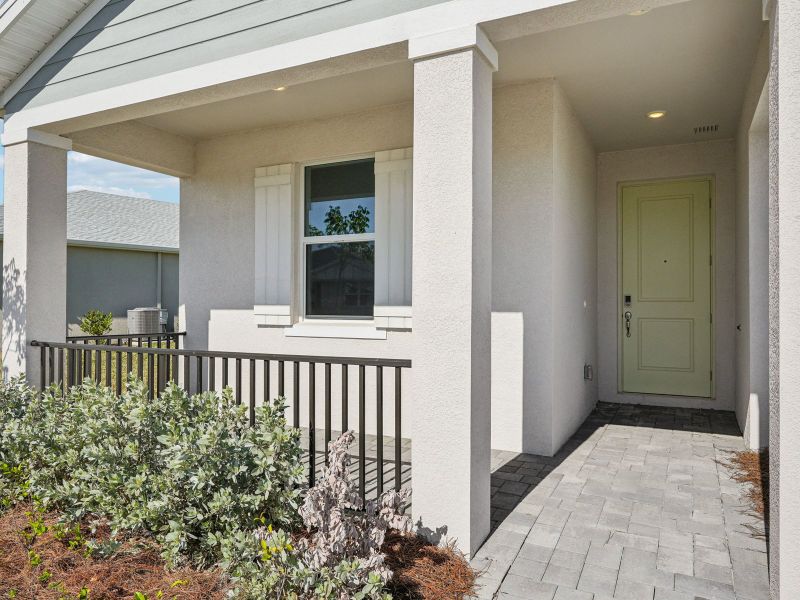Exterior details and patio area of a home in Crescent Lakes - Reserve Series, Punta Gorda (Image 3).