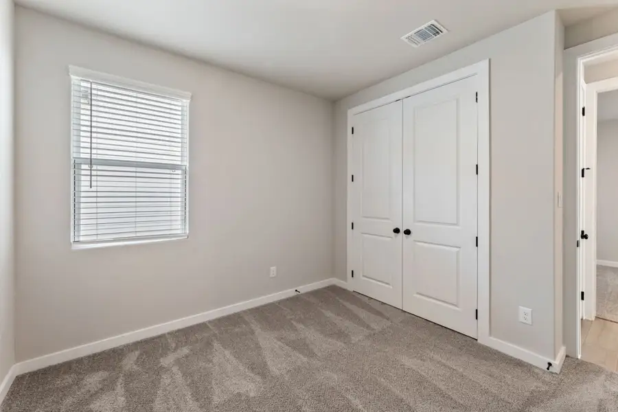 Representative unfurnished interior of a home built from the Pecos by Hakes Brothers in Highland Ridge, New Braunfels (Image 38).