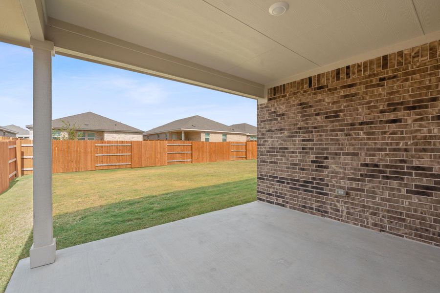 Fenced backyard featuring a patio and a residential view Fenced backyard featuring a patio and a residential view