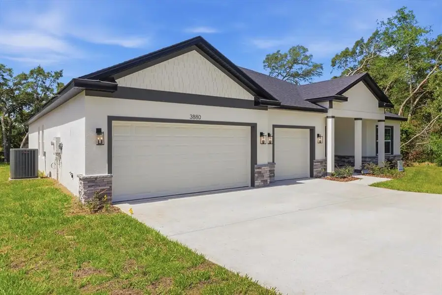 Front exterior of a new home in , Ocala, FL, highlighting curb appeal (Image 2). Front exterior of a new home in , Ocala, FL, highlighting curb appeal (Image 2).