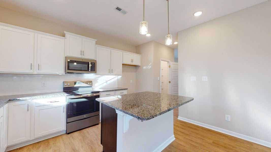 Representative furnished interior of a home built from the Jacob A by JC Jackson Homes,LLC in Heritage Pointe, Newport (Image 6).