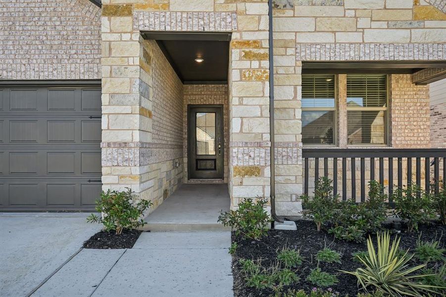 Exterior details and patio area of a home in Lakehaven - Premier Series, Farmersville (Image 3).