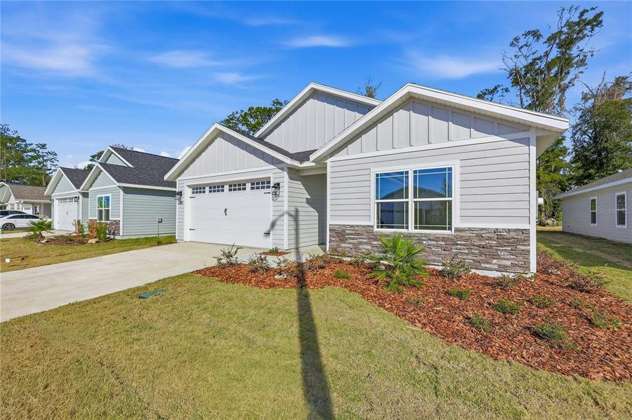 Front exterior of a new home in , Gainesville, FL, highlighting curb appeal (Image 2). Front exterior of a new home in , Gainesville, FL, highlighting curb appeal (Image 2).