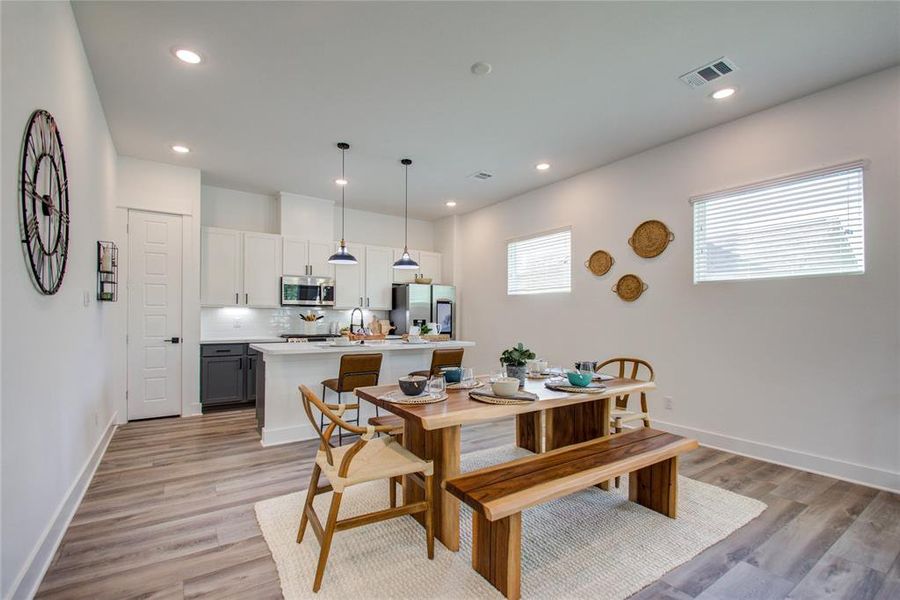 Enjoy the spacious dining area ideal for family and friends' gatherings! Model home photos - FINISHES AND LAYOUT MAY VARY! Ceiling fans are NOT INCLUDED!