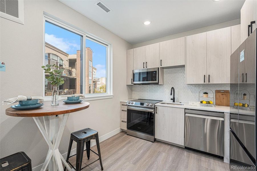 Similarly staged unit; Tighter photo of Kitchen