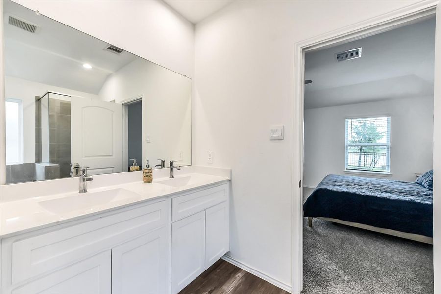 Furnished interior view inside a new home in Sunterra, Katy (Image 27).