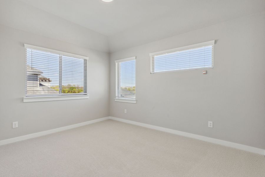 Bedroom in the Picasso II home plan by Trophy Signature Homes – REPRESENTATIVE PHOTO