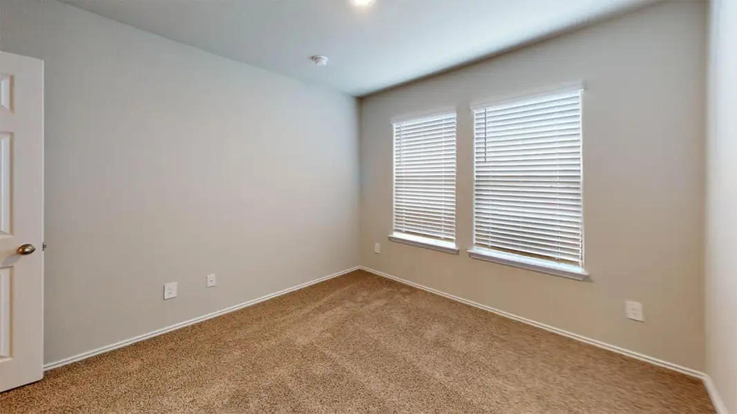 Unfurnished room with carpet and baseboards