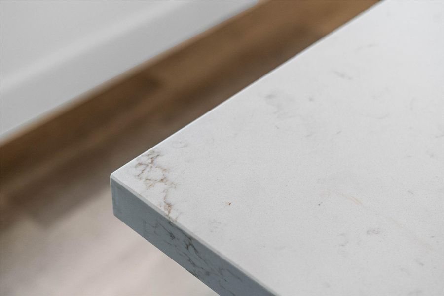 Kitchen countertops - Calacatta Rusta Quartz with subtle, elegant veining and a clean, modern edge profile.