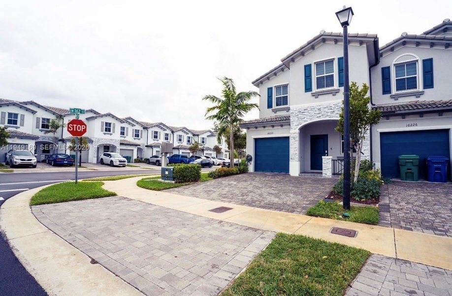 Front exterior of a new home in , Homestead, FL, highlighting curb appeal (Image 22).