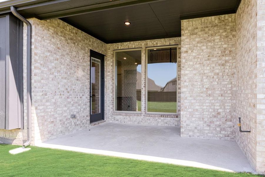 Exterior details and patio area of a home in Windsong Ranch Classic 61, Prosper (Image 19). Exterior details and patio area of a home in Windsong Ranch Classic 61, Prosper (Image 19).
