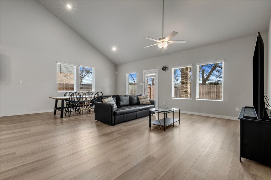 Spacious and light-filled living area designed for comfort and everyday living. The open layout provides ample room for seating and entertainment, with large windows that allow natural light to flow throughout the space.