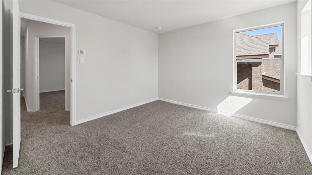 Unfurnished room with carpet
