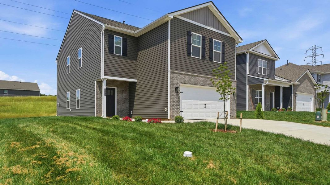 Front exterior of a new home in Fieldcrest Acres, Blountville, TN, highlighting curb appeal (Image 2). Front exterior of a new home in Fieldcrest Acres, Blountville, TN, highlighting curb appeal (Image 2).