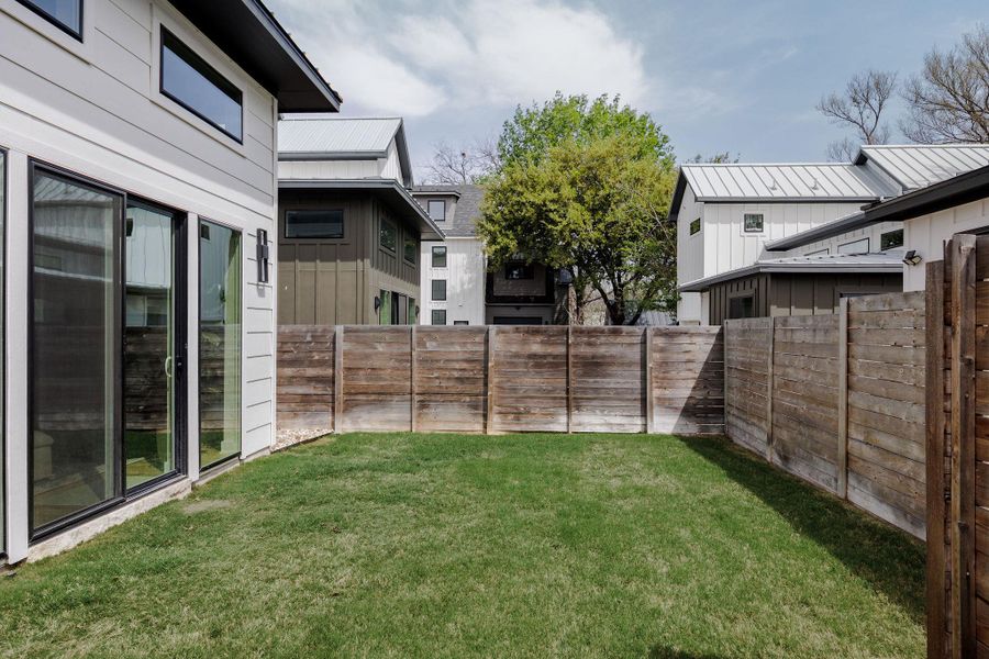 View of fenced backyard