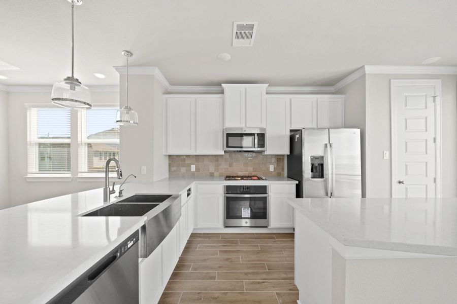 Stunning kitchen with central island (*Photo not of actual home and used for illustration purposes only.) Stunning kitchen with central island (*Photo not of actual home and used for illustration purposes only.)