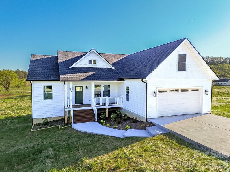 Front exterior of a new home in , Hendersonville, NC, highlighting curb appeal (Image 1). Front exterior of a new home in , Hendersonville, NC, highlighting curb appeal (Image 1).