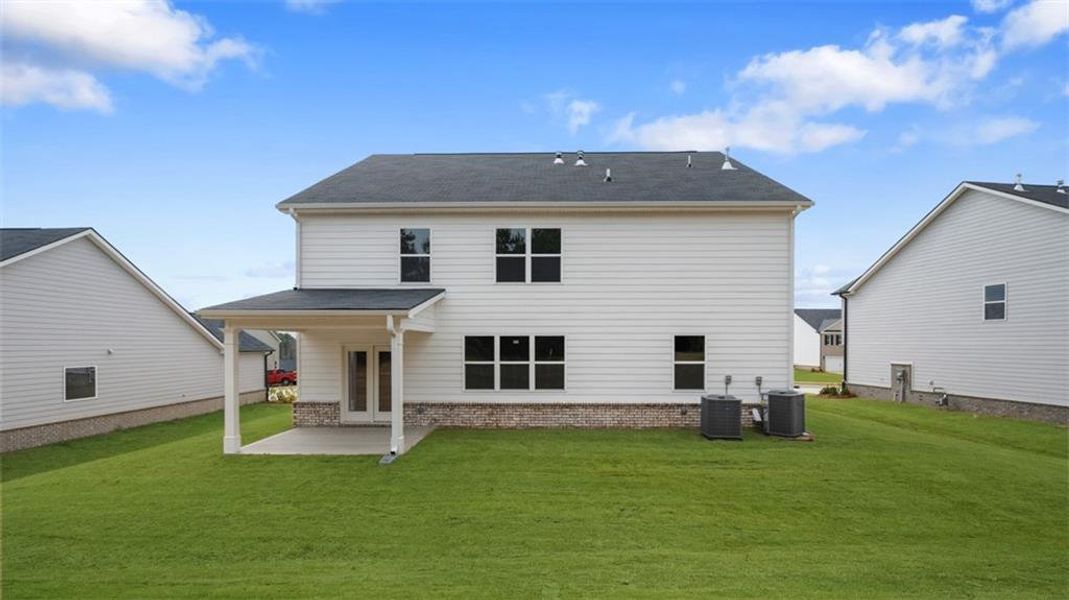 Exterior details and patio area of a home in Bridle Creek, Locust Grove (Image 25).