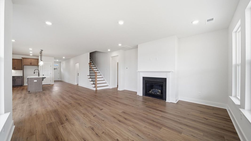 Notable family room designed with high standards—perfect for both everyday living and entertaining located at Iris Meadows