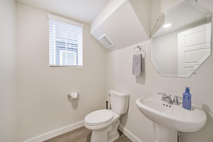 The 1st floor also has this discreet half bathroom. The 1st floor also has this discreet half bathroom.