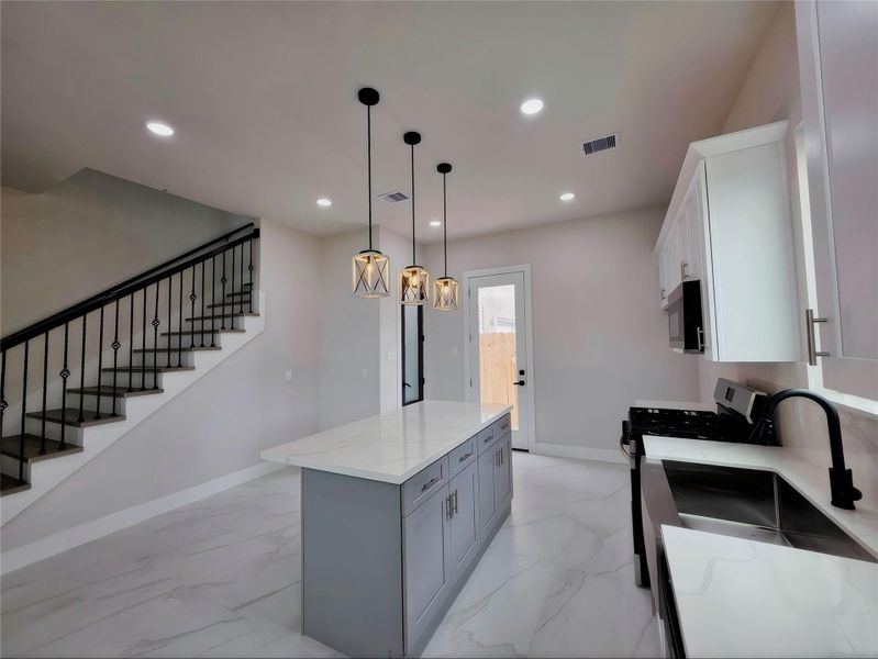 1071 Ferguson Way white & grey inviting tiles downstairs.