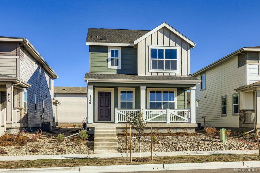 Front exterior of a new home in Percheron: The Explorer Collection, Colorado Springs, CO, highlighting curb appeal (Image 1).