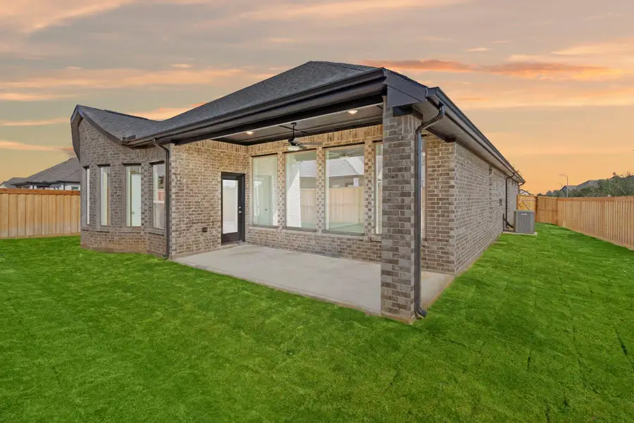 Exterior details and patio area of a home in Dunham Pointe 50', Cypress (Image 4).