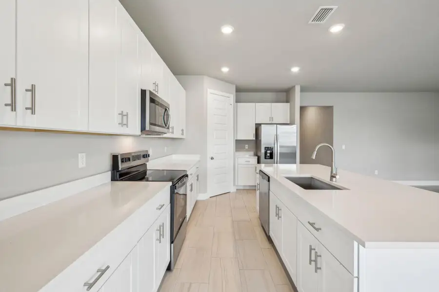 Furnished interior view inside a new home in Brystol at Wylder - Reserve Series, Port St. Lucie (Image 8).