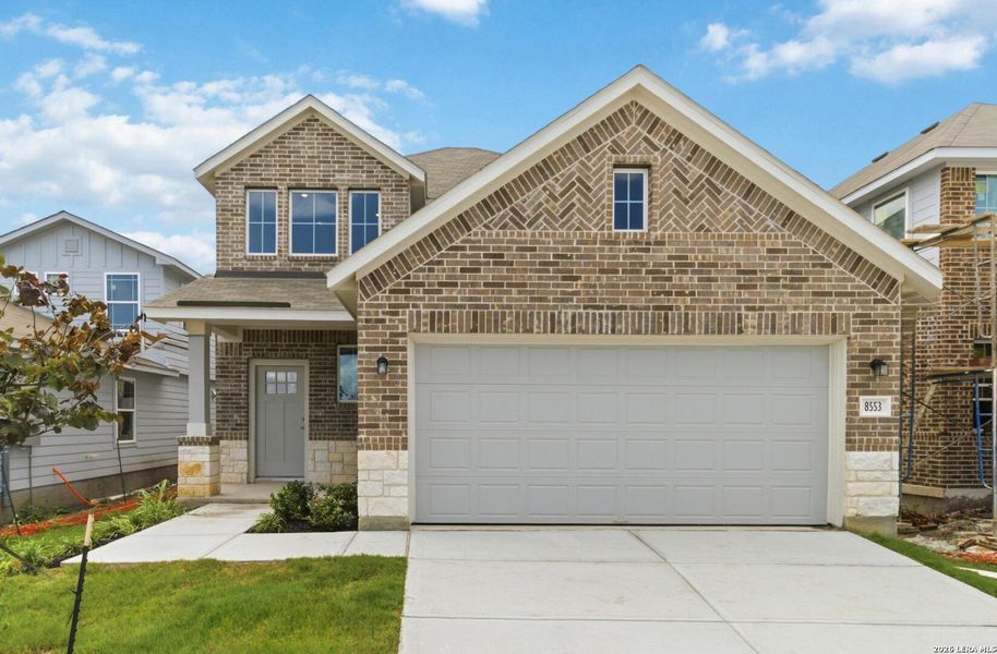 Front exterior of a new home in Red Hawk Landing, San Antonio, TX, highlighting curb appeal (Image 2). Front exterior of a new home in Red Hawk Landing, San Antonio, TX, highlighting curb appeal (Image 2).