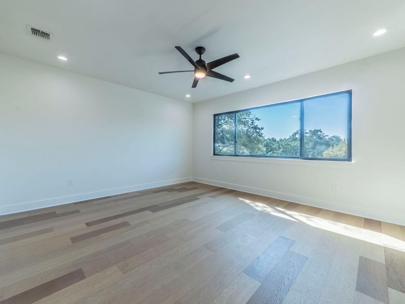 Unfurnished room with light wood-style flooring, recessed lighting, and ceiling fan Unfurnished room with light wood-style flooring, recessed lighting, and ceiling fan