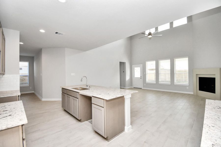 Discover another perspective of the spacious kitchen! Sample photo of completed home with similar floor plan. Actual colors and selections may vary.