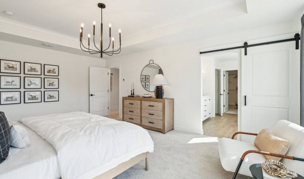 Primary suite with sliding barn door to private bath Primary suite with sliding barn door to private bath