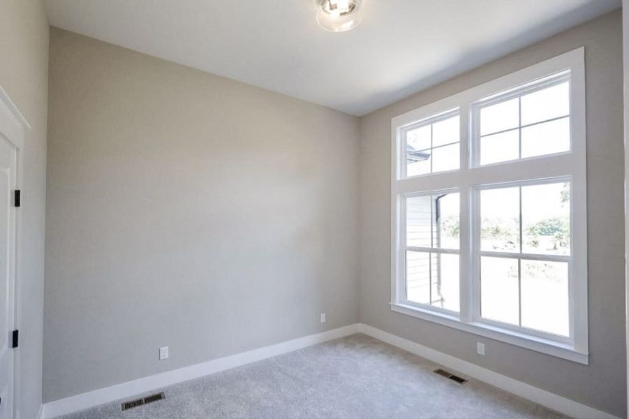 Spacious, unfurnished interior of a new home in Baker Road, Birchwood (Image 69).