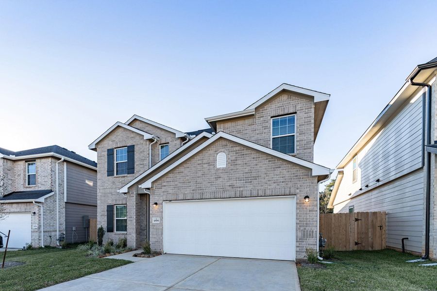 Front exterior of a new home in Cielo, Conroe, TX, highlighting curb appeal (Image 2).