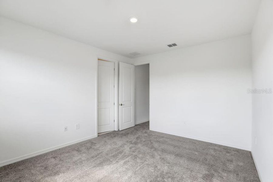 Spacious, unfurnished interior of a new home in Harvest at Ovation, Winter Garden (Image 28).