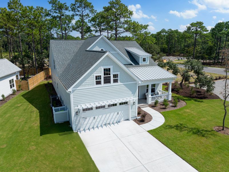 Front exterior of a new home in Osprey Landing, Southport, NC, highlighting curb appeal (Image 21).