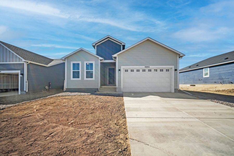 Front exterior of a new home in The Glen-12, Colorado Springs, CO, highlighting curb appeal (Image 28). Front exterior of a new home in The Glen-12, Colorado Springs, CO, highlighting curb appeal (Image 28).