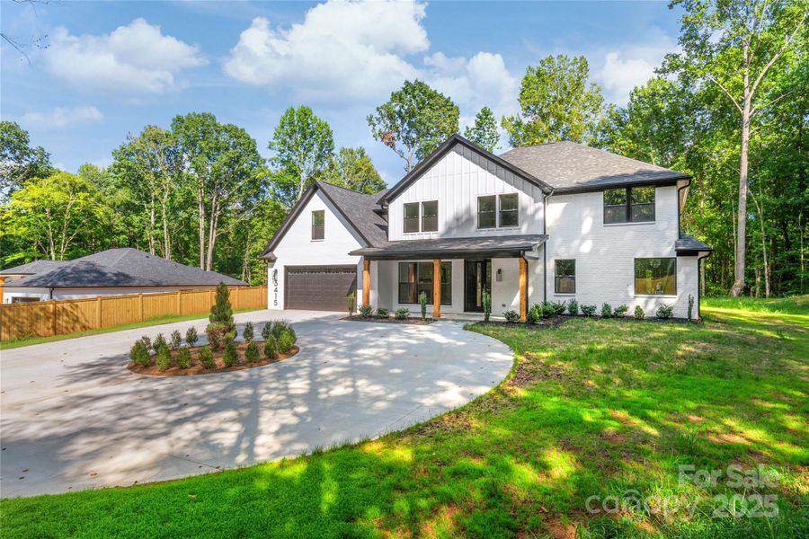 Front exterior of a new home in , Waxhaw, NC, highlighting curb appeal (Image 27). Front exterior of a new home in , Waxhaw, NC, highlighting curb appeal (Image 27).